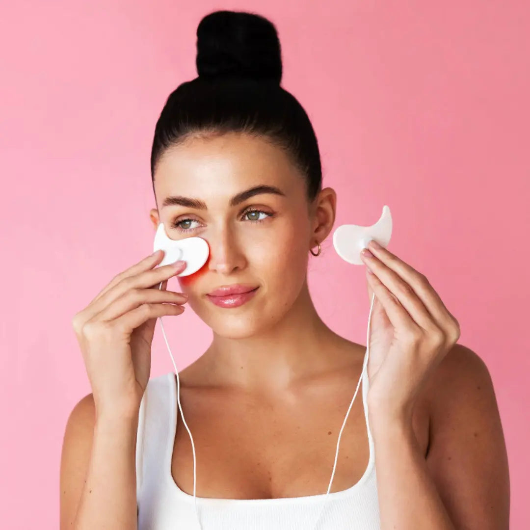 Assorted skincare and beauty tools including an IPL hair removal device, LED face mask, facial roller, and cleansing brush, designed for Korean skincare routines and achieving glass skin at home