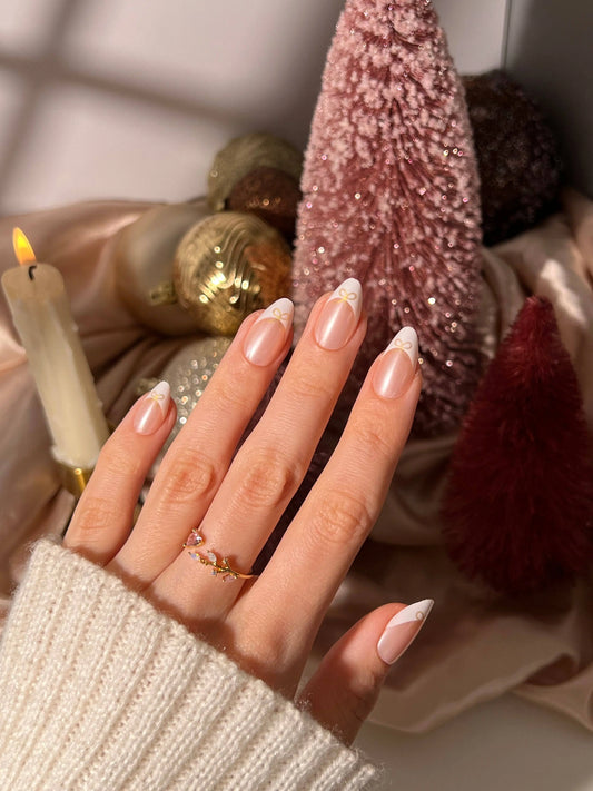 Frenchie Bow Press-On Nail Set featuring almond-shaped tips with a pearl chrome finish and delicate bow accents. These high-quality press-on nails offer a salon-quality look with long-lasting wear, designed for easy at-home application. The set includes multiple nail sizes, nail glue, a cuticle stick, nail file, prep pad, and a reusable storage box. Ideal for elegant, mess-free manicures that last up to two weeks._NextGen Glam


